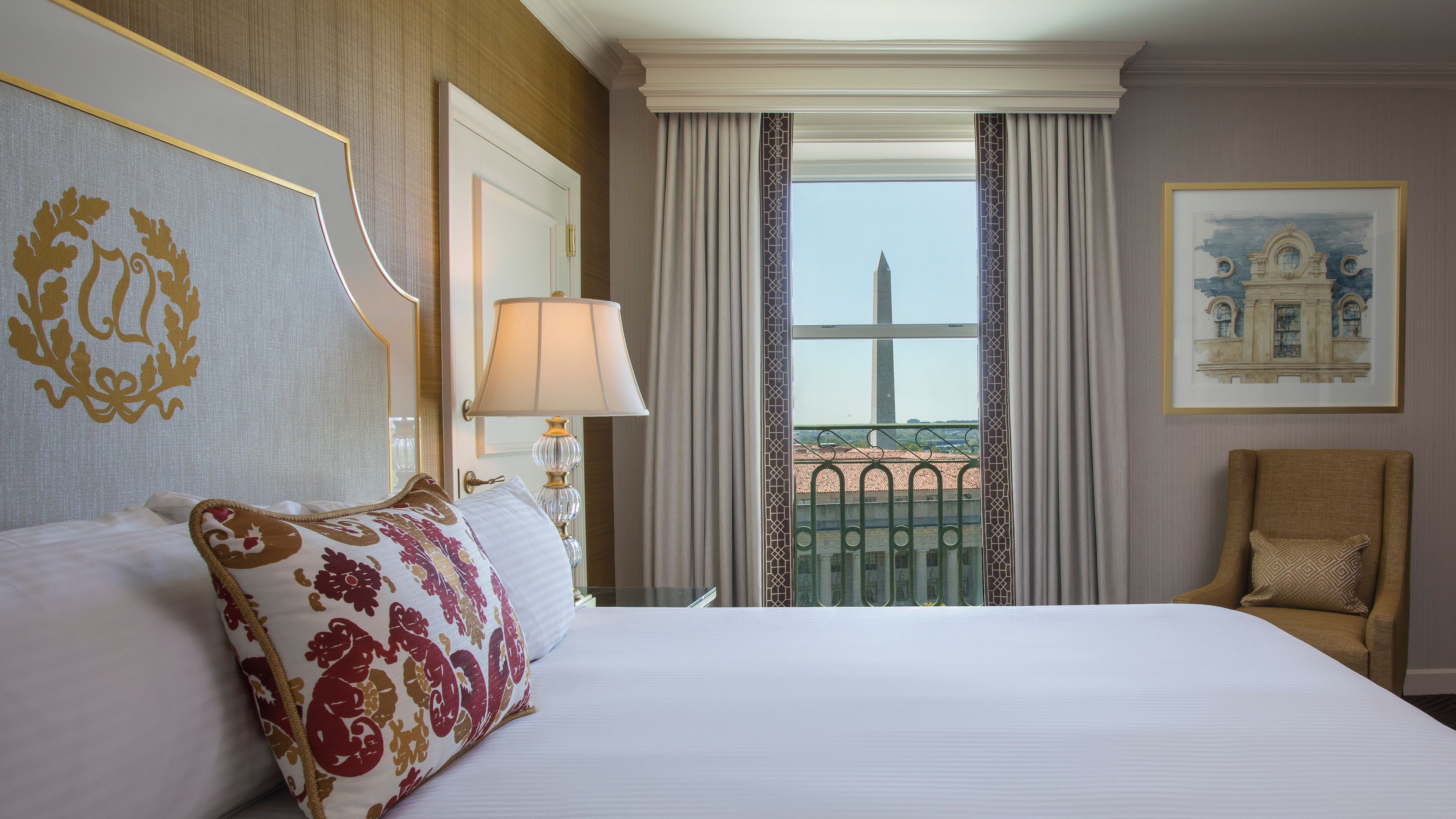 a bed with a lamp and a window