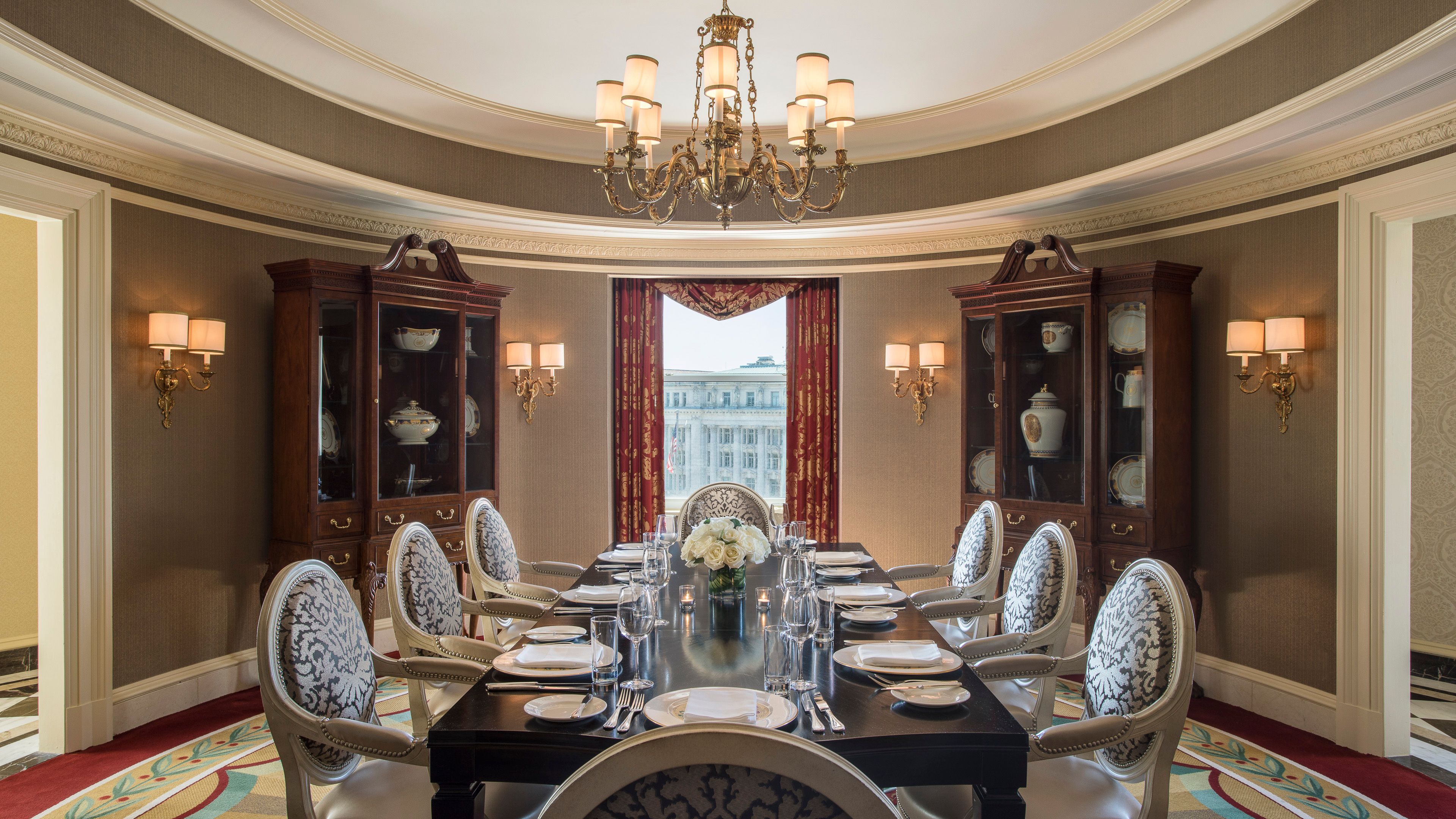 a dining room with a chandelier and a table