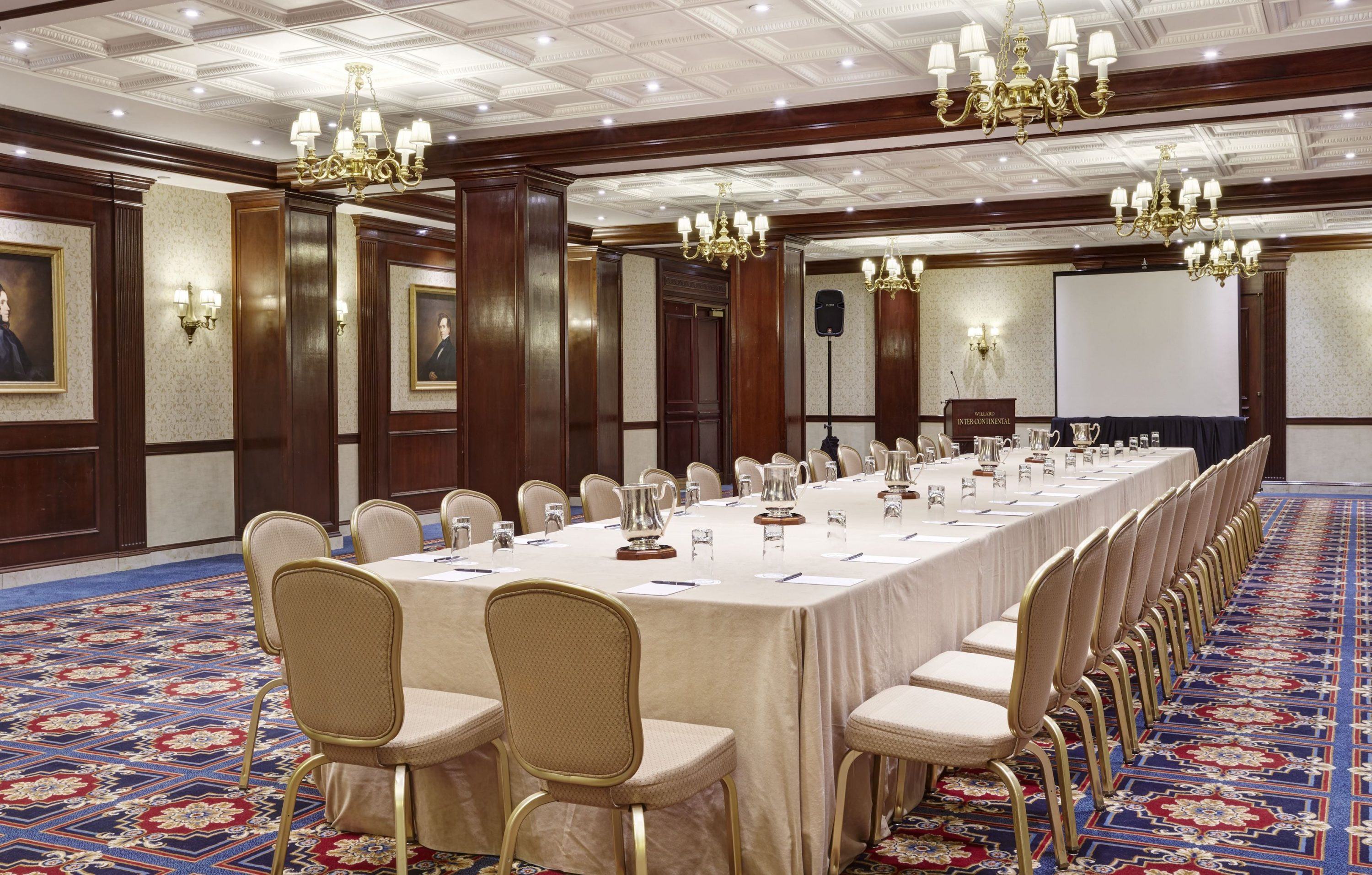 a large conference room with a table and chairs