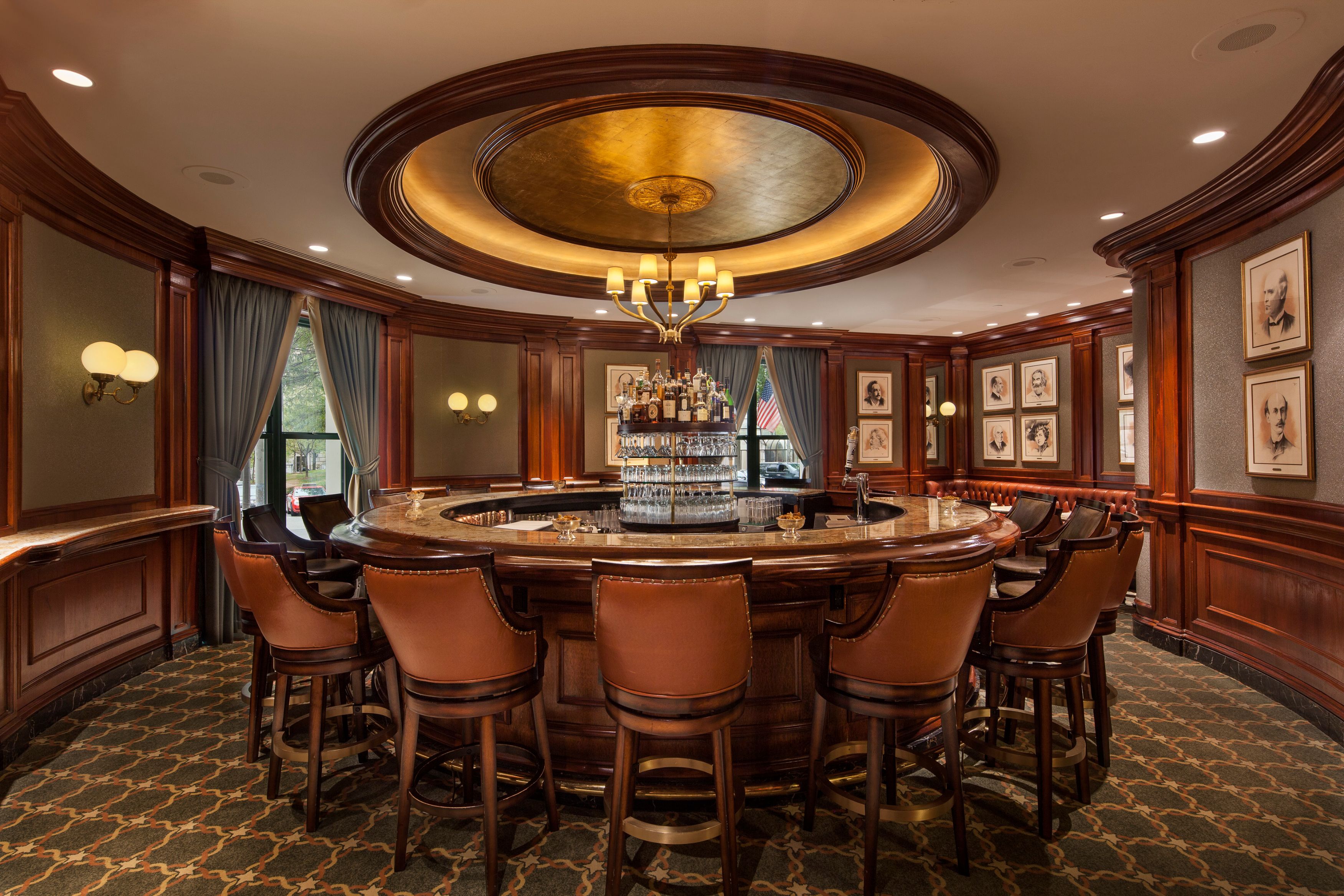 a room with a round table and chairs