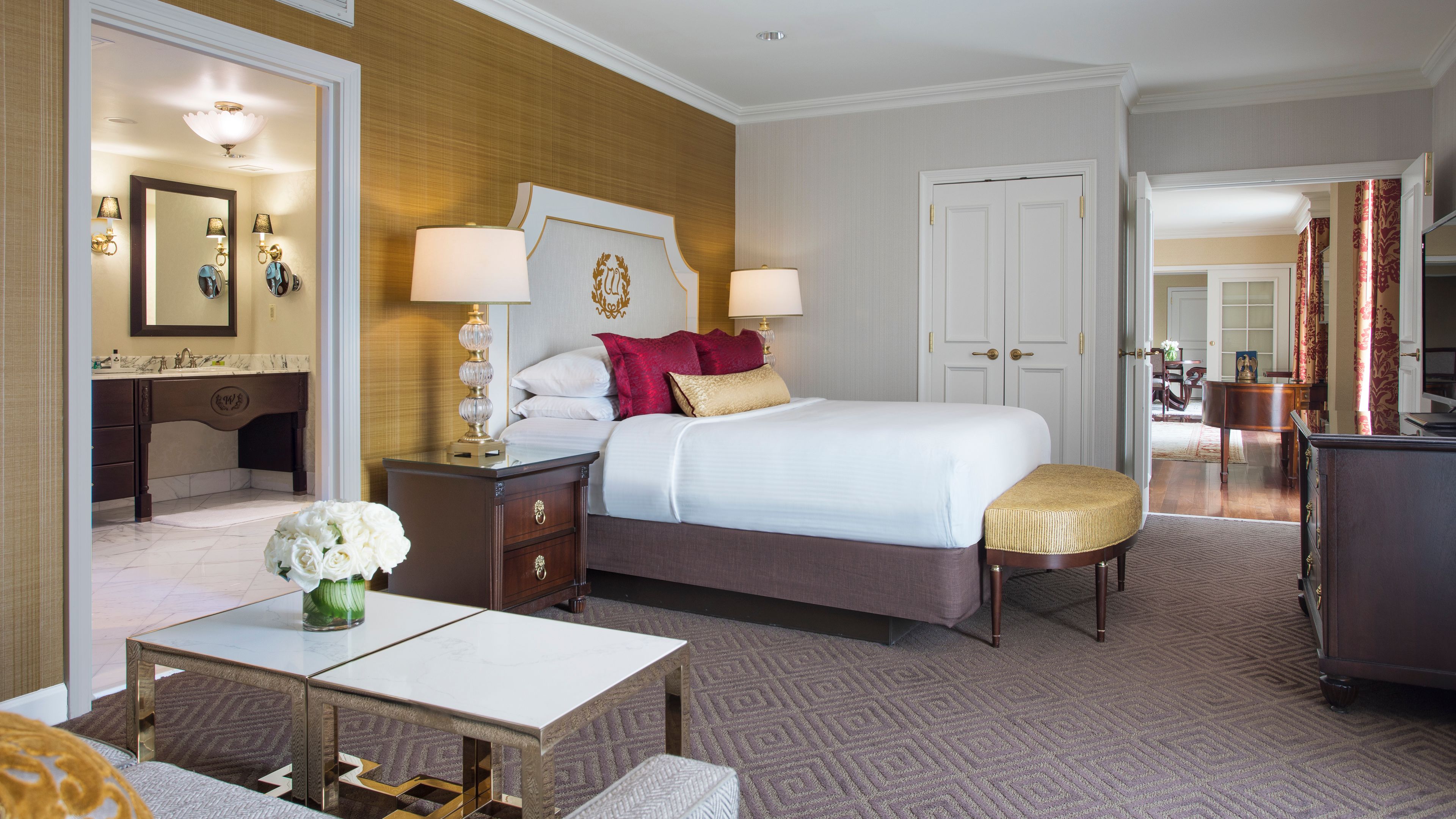 a bedroom with a bed and a table