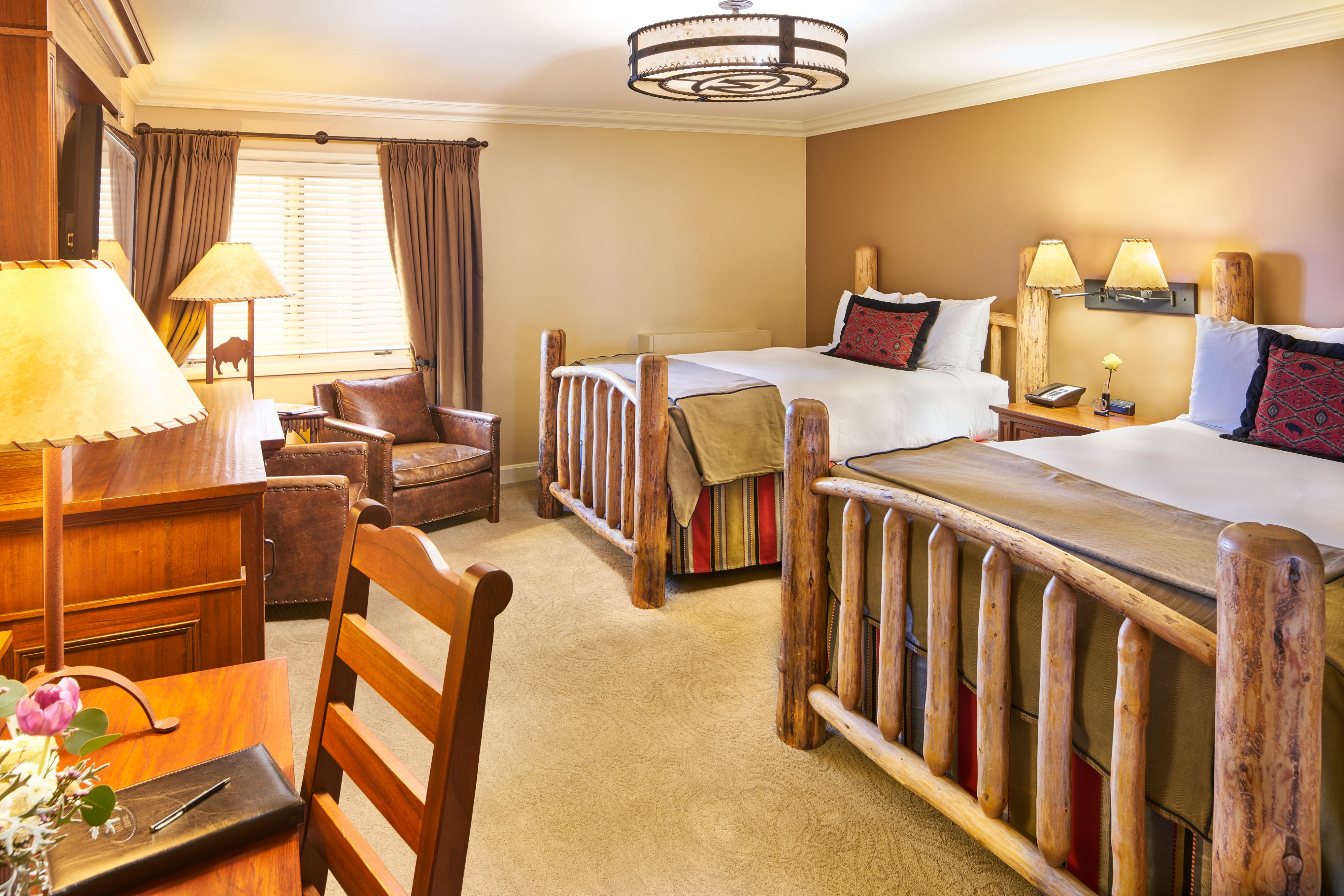 image of deluxe guestroom two beds the wort hotel jackson wyoming_high