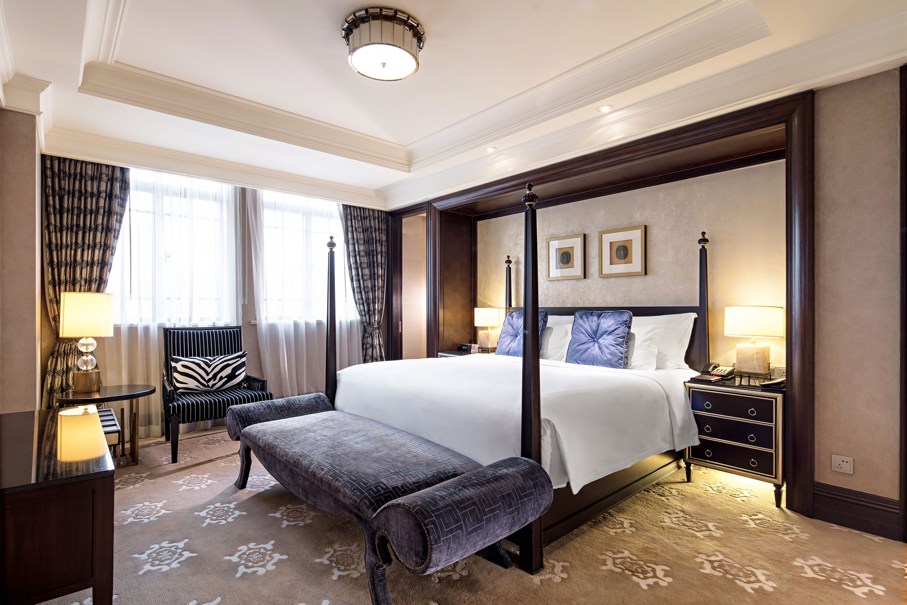 a room with a bed and a chair