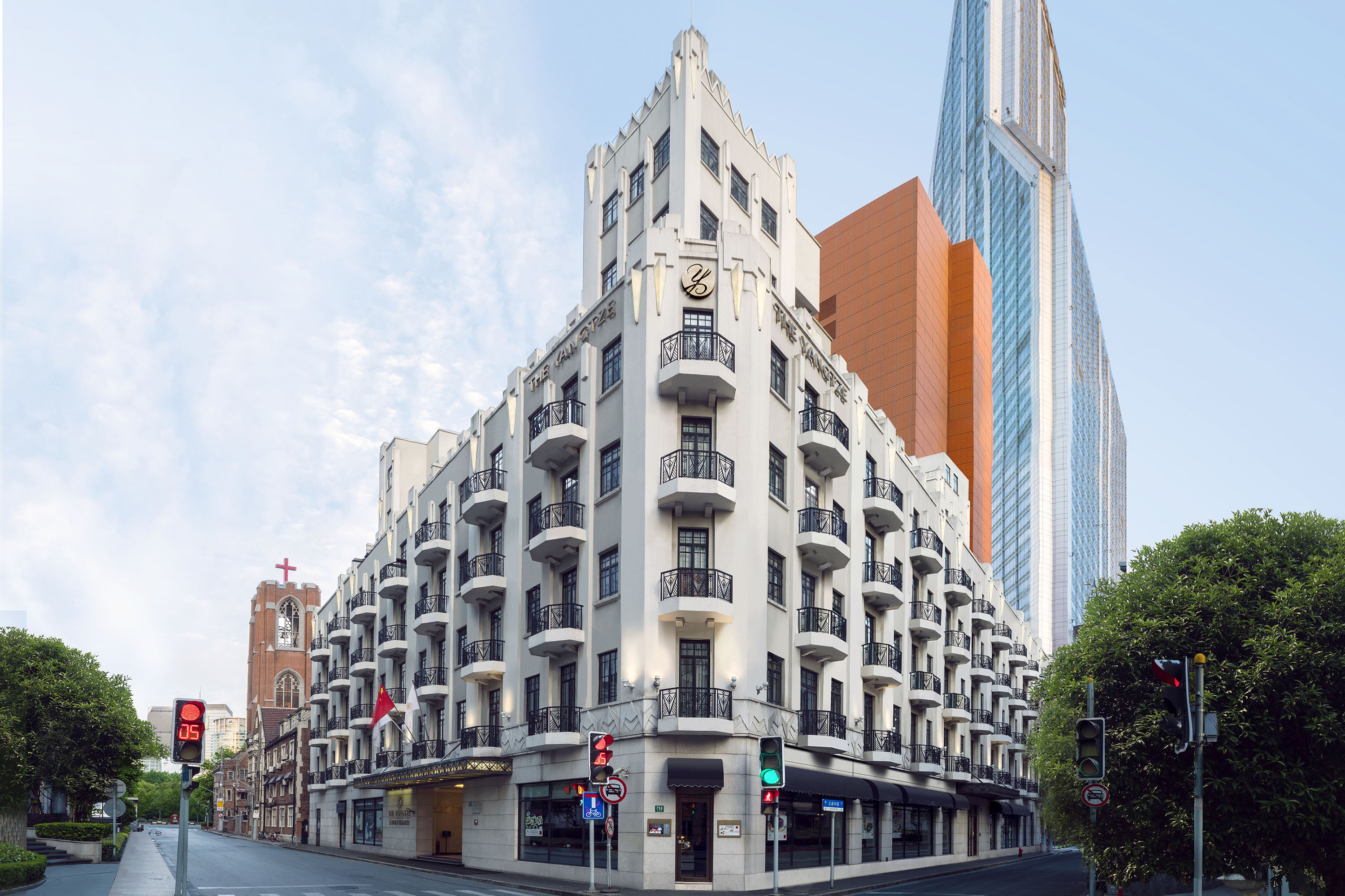a building with many balconies and a street corner
