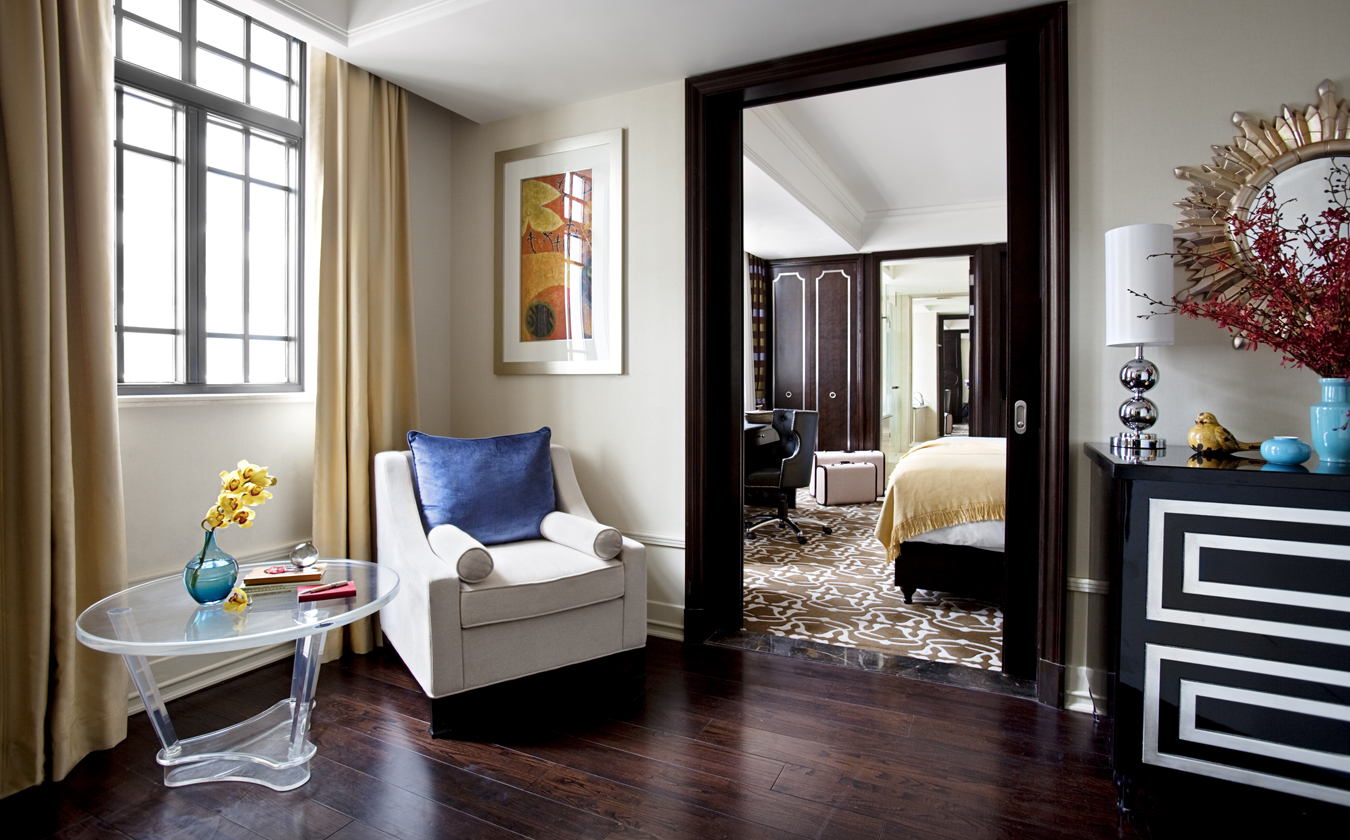 a room with a door open and a chair