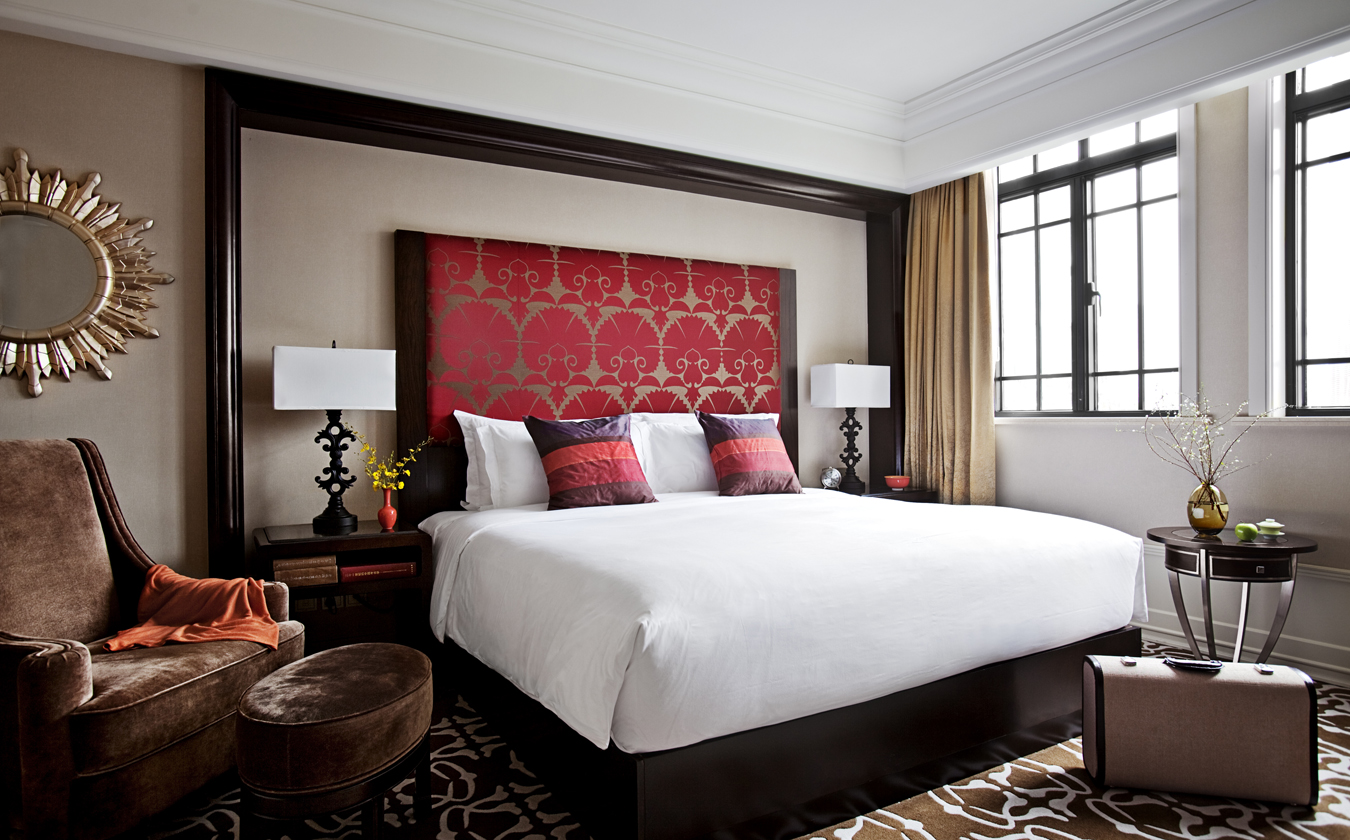 a bed with a red headboard