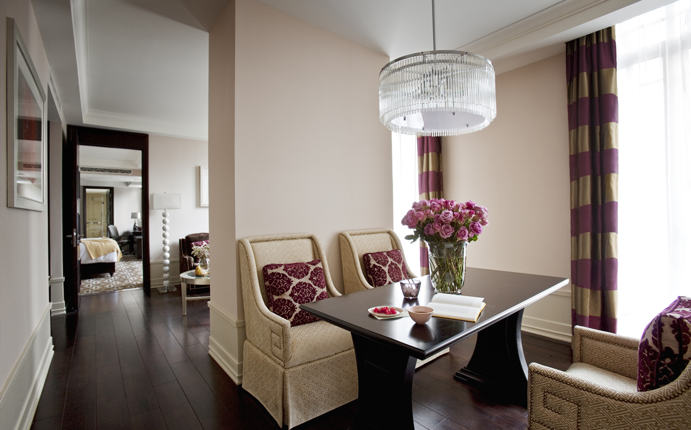 a dining room with a chandelier and a table