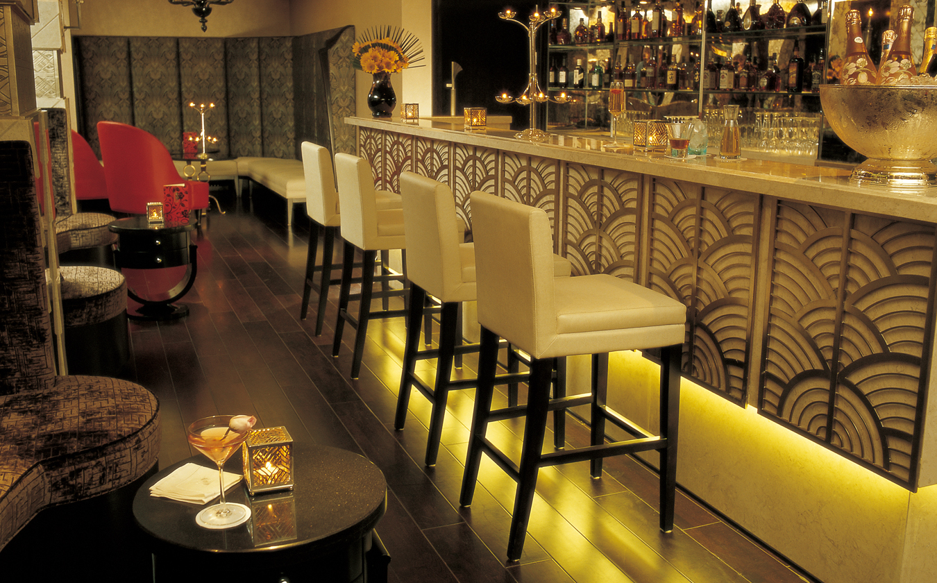 a bar with a row of chairs