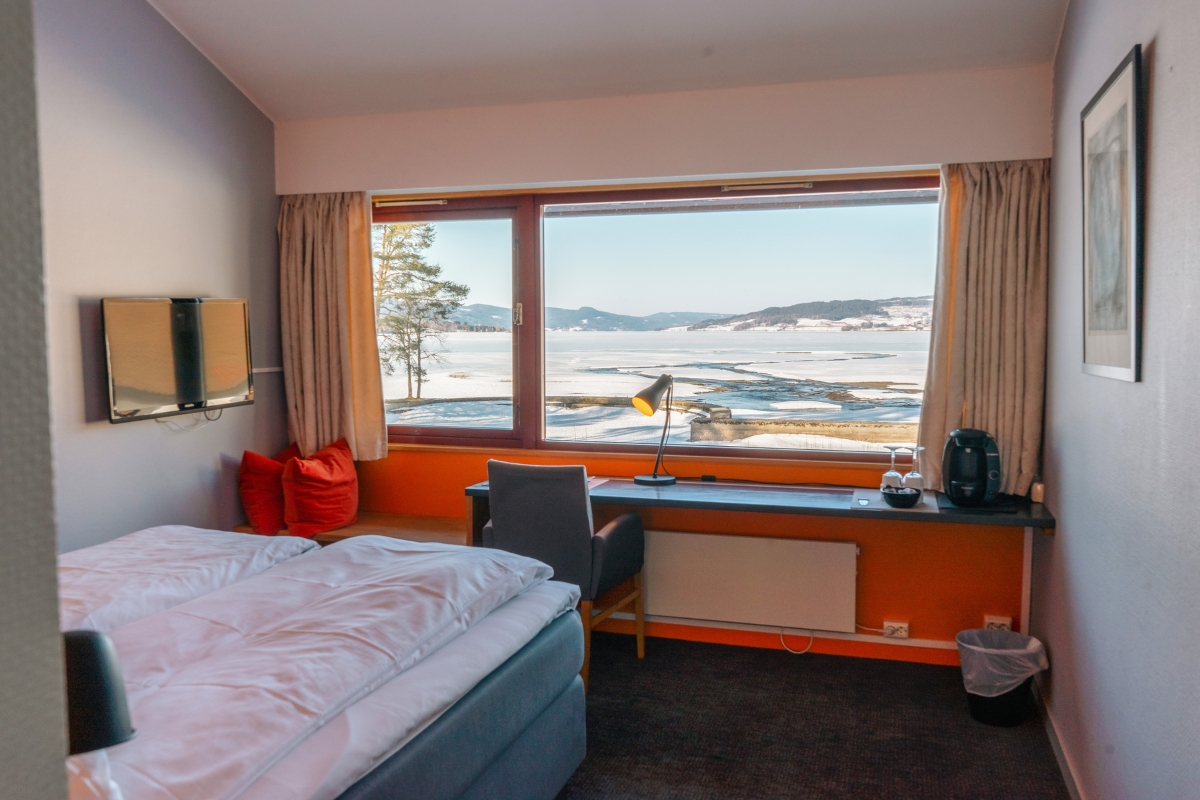 a room with a bed and a window