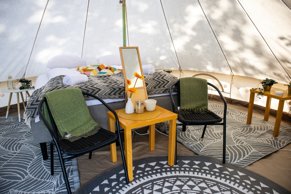 a table and chairs in a tent