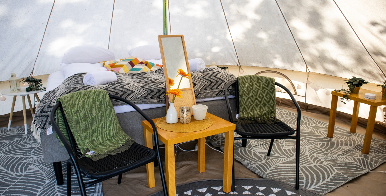 a table and chairs in a tent