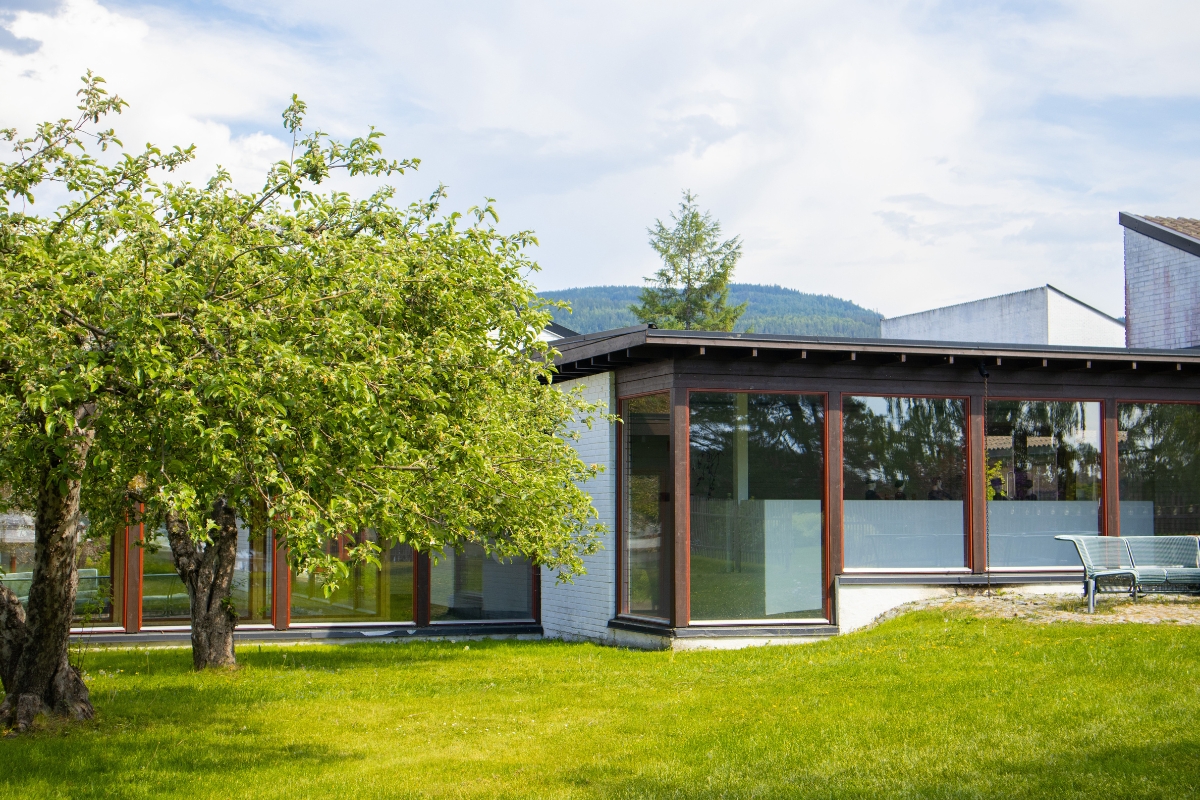 a building with a tree in the back