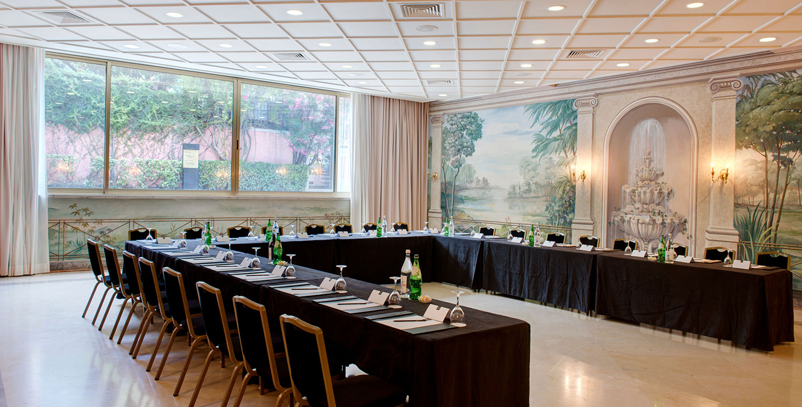 a large room with long tables and chairs