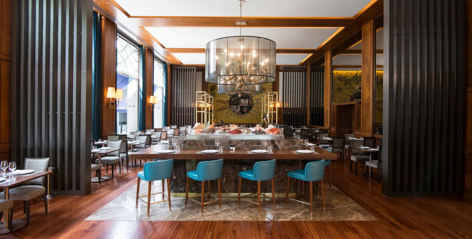 a restaurant with a large table and chairs