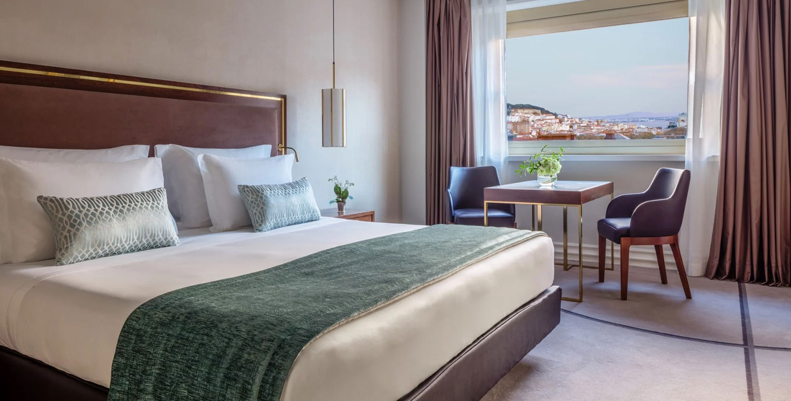 a bedroom with a bed and a table