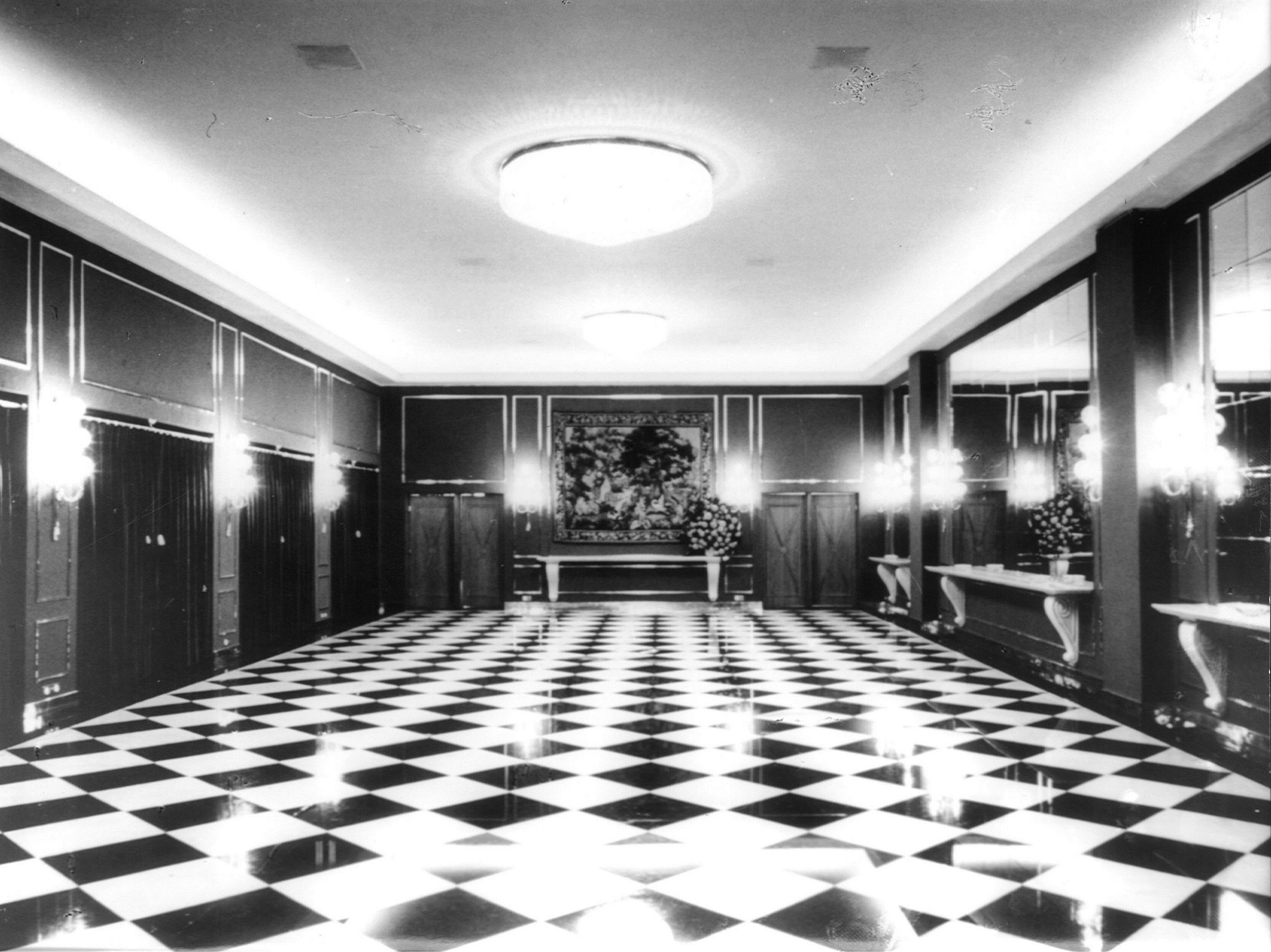 a black and white photo of a hall
