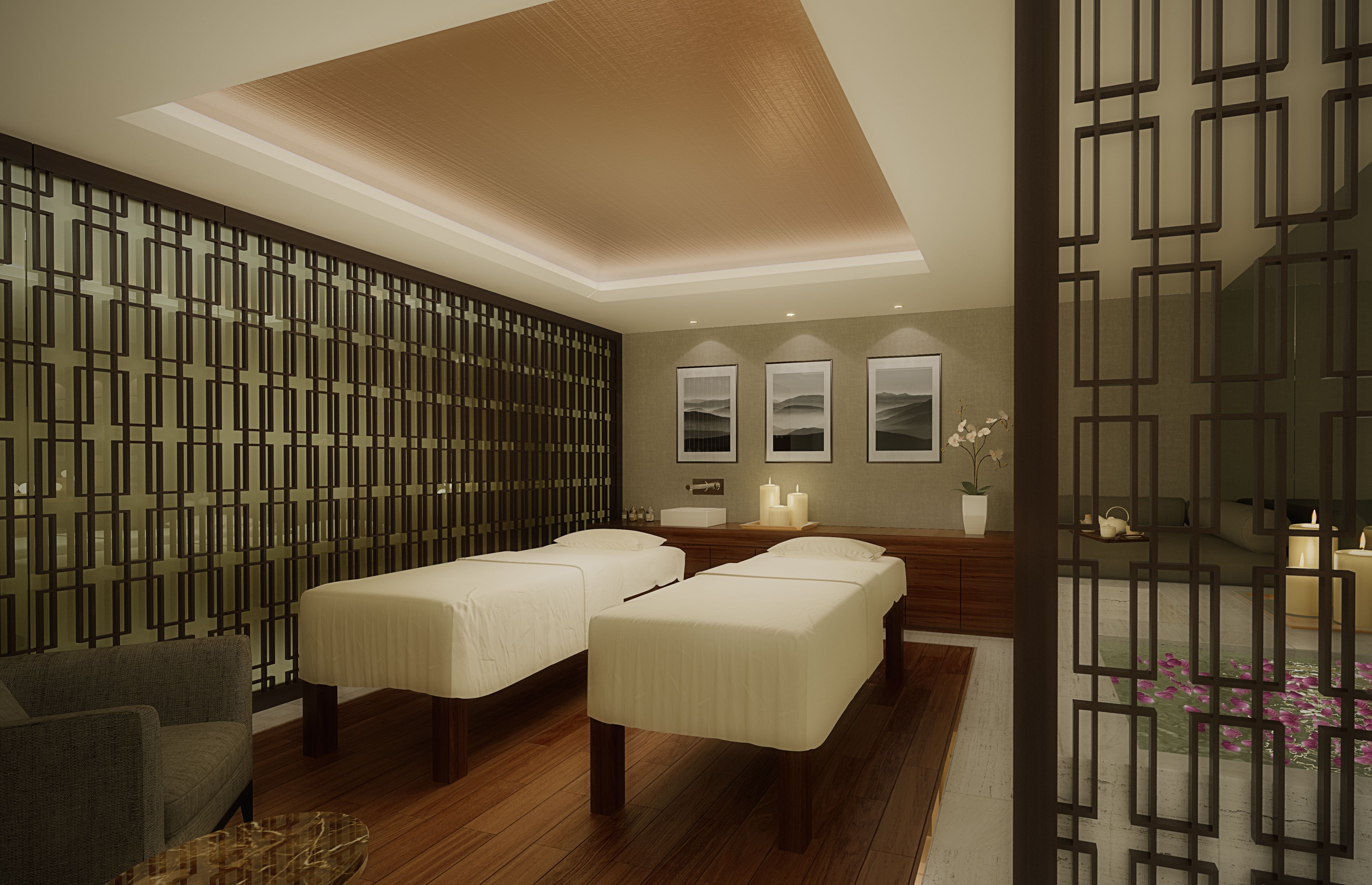 a room with beds and a wall with art on the wall