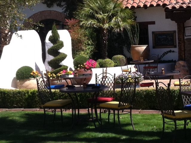 a table and chairs in a yard