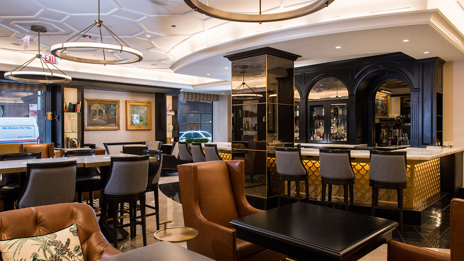 a room with a bar and chairs