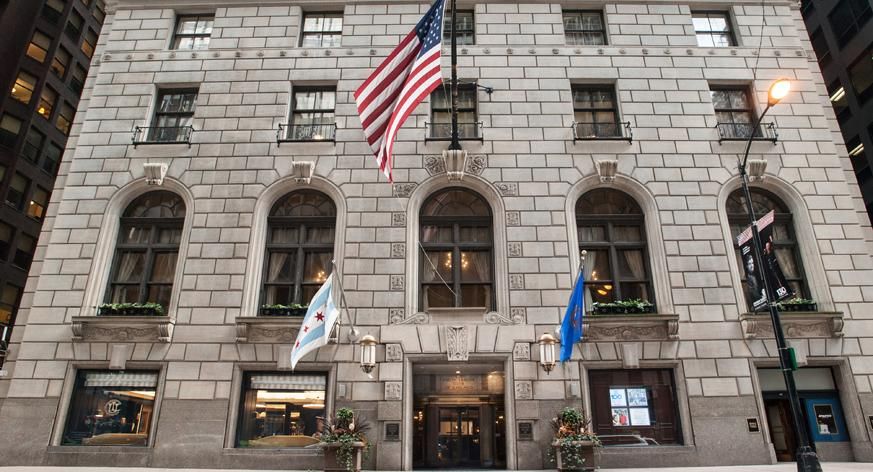 a building with flags on the front