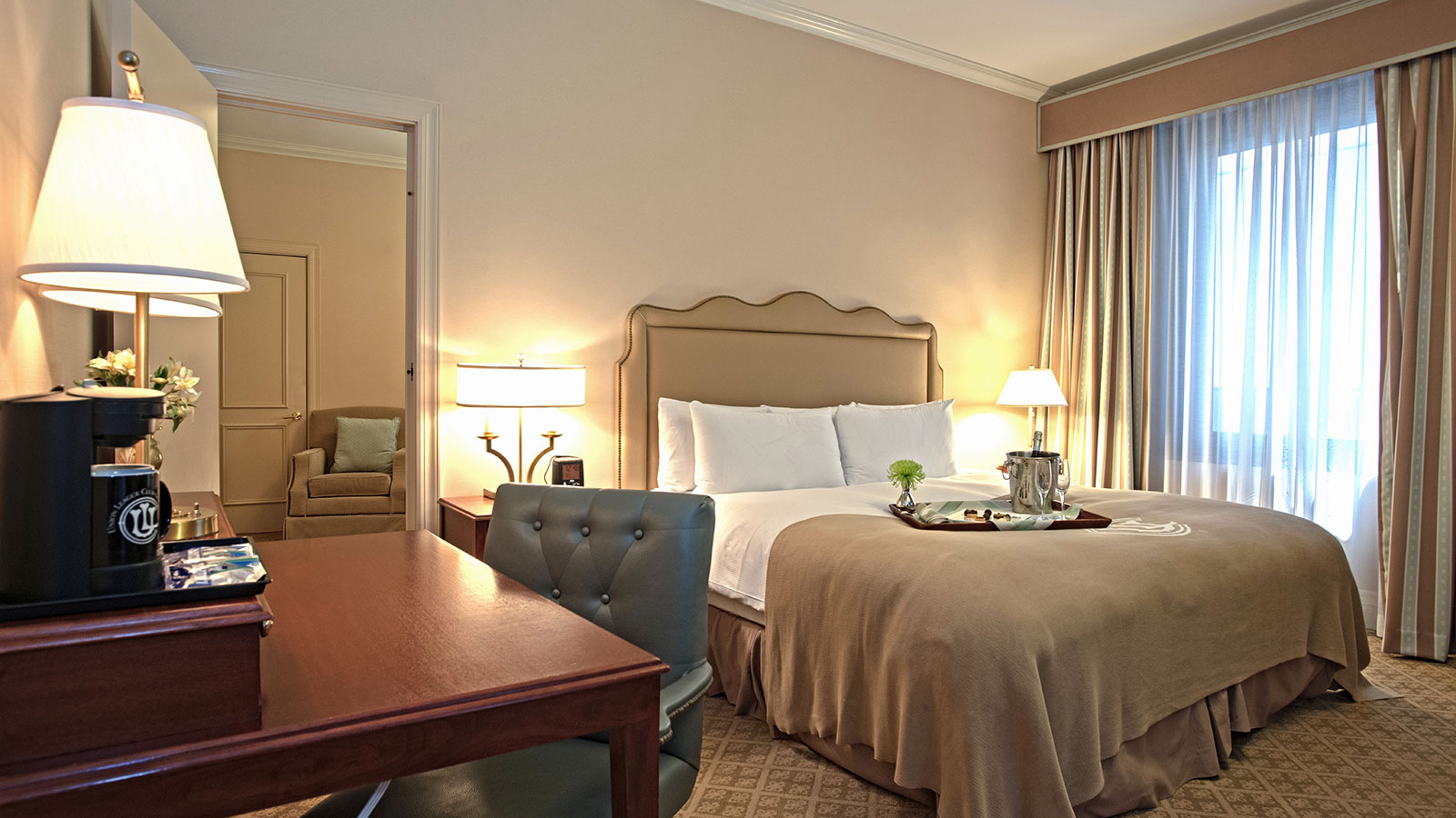 a hotel room with a bed and a table