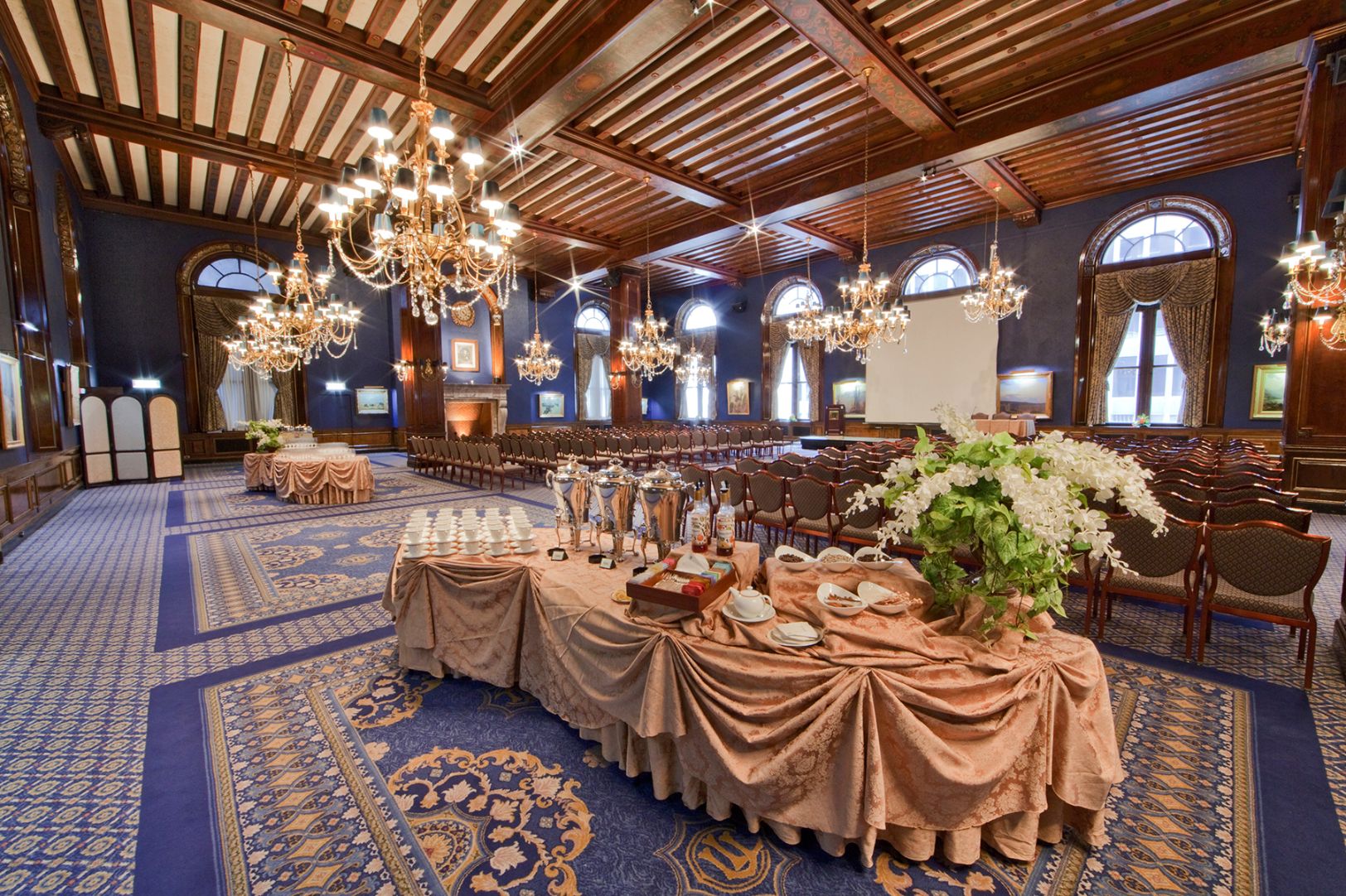 a large room with a large table set for a formal event