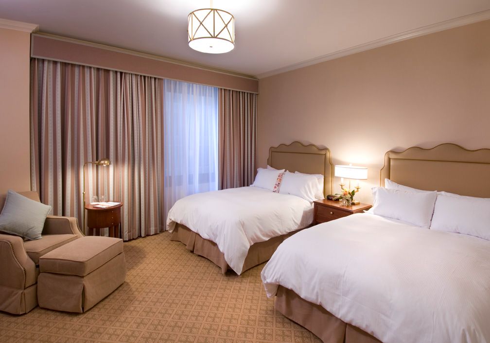 a hotel room with two beds
