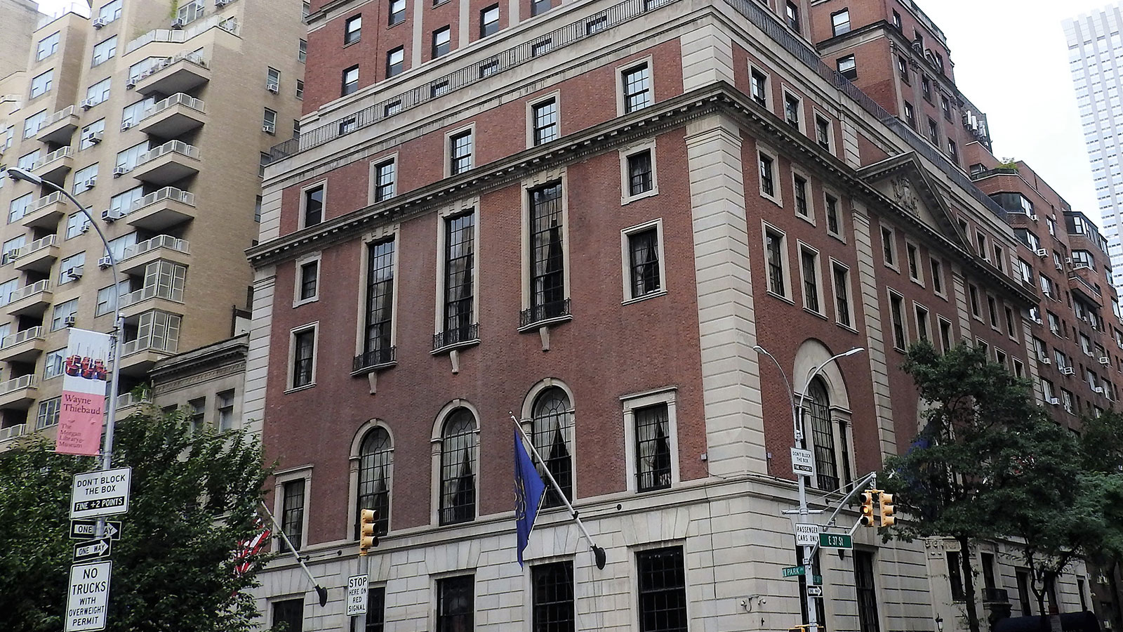 a building with a flag on the corner