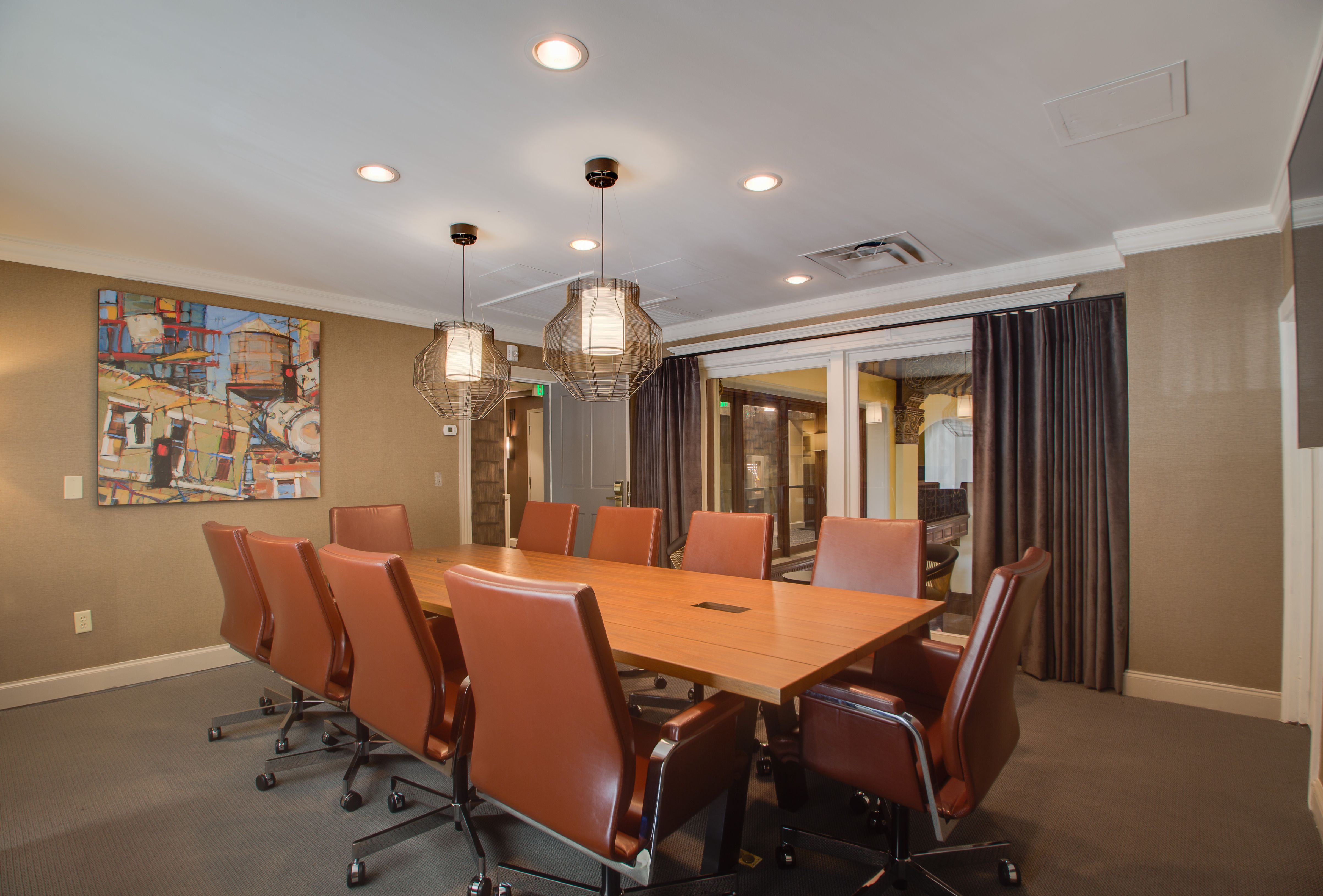 a conference room with a table and chairs