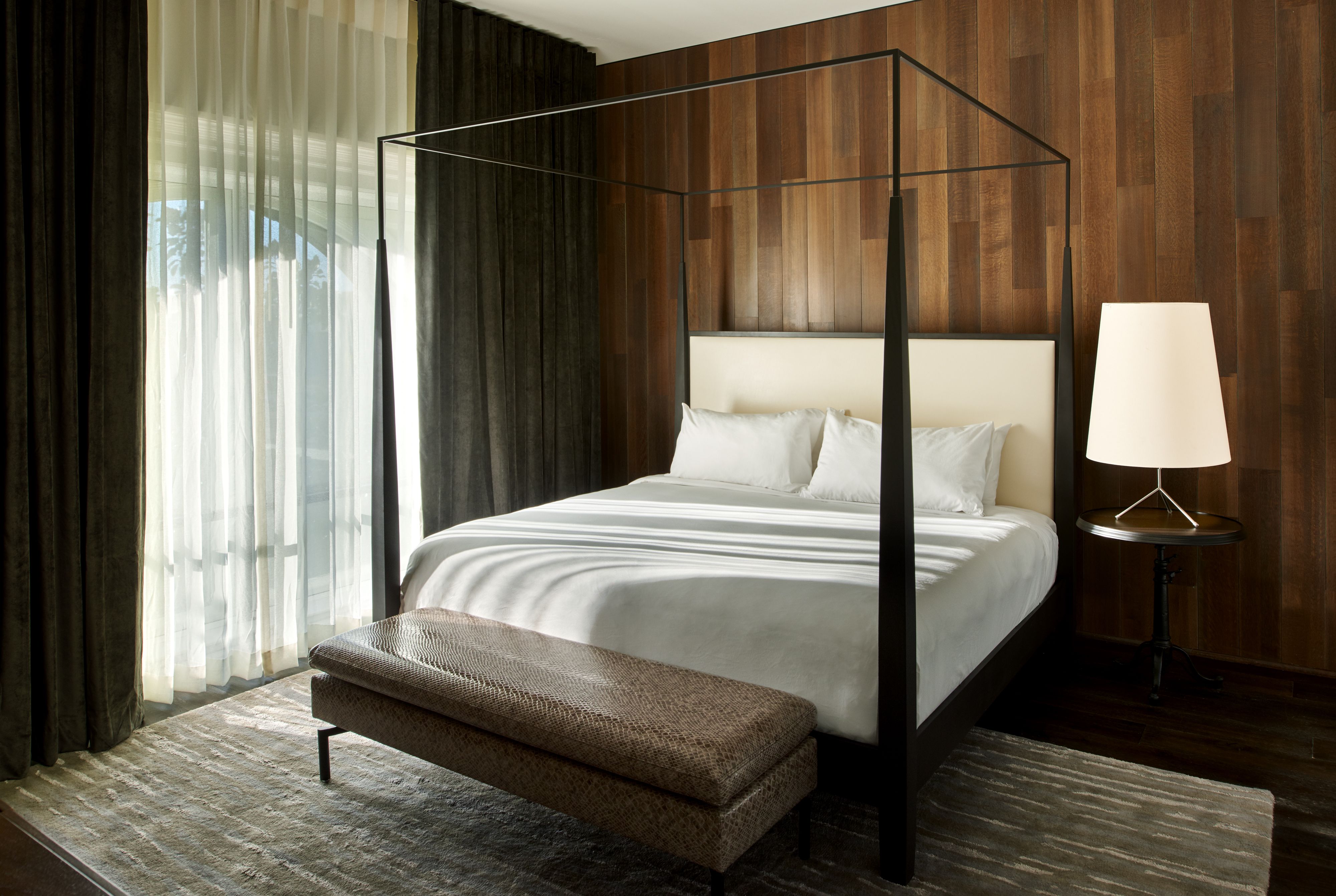 a bed with a canopy in a room