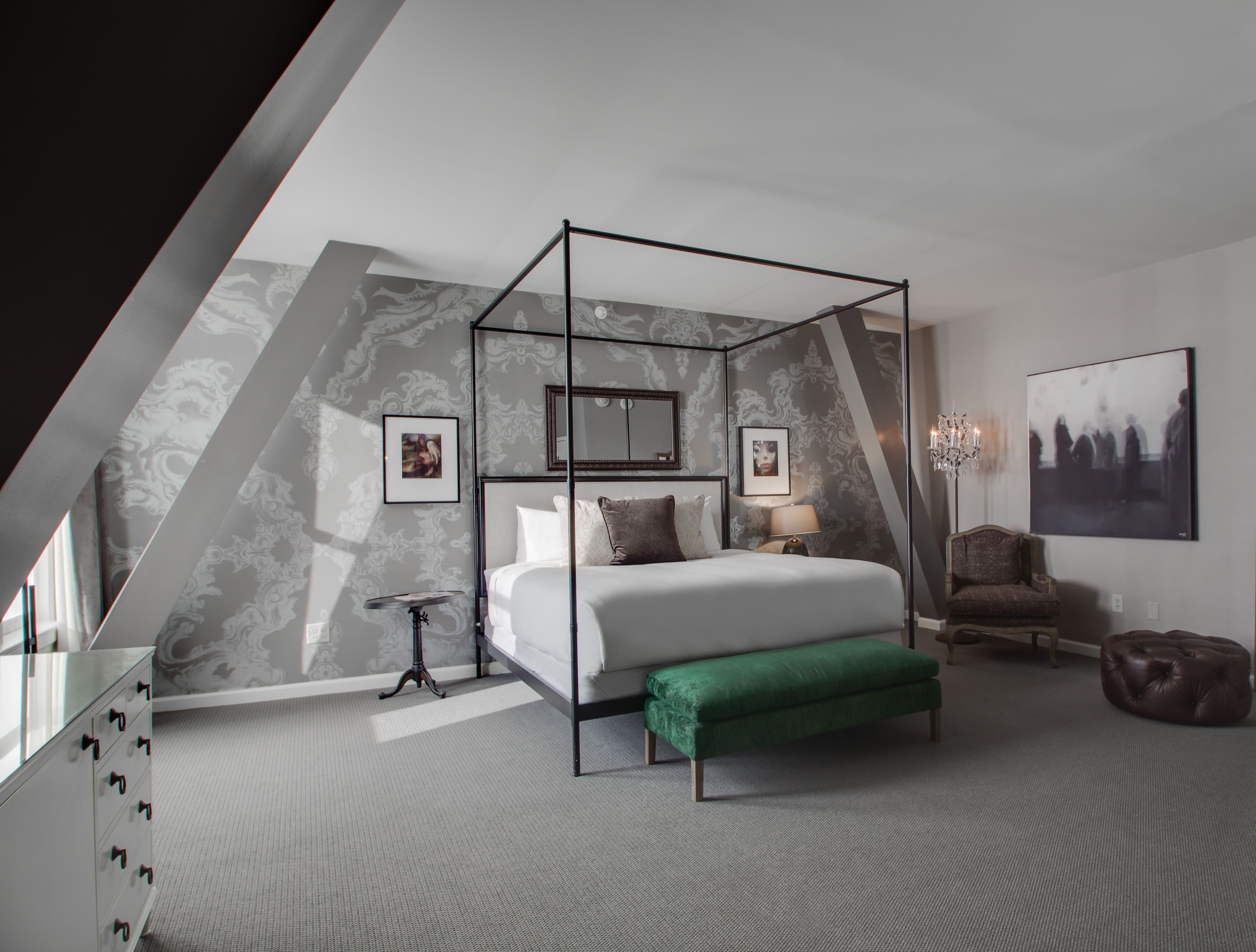 a room with a bed and a chair