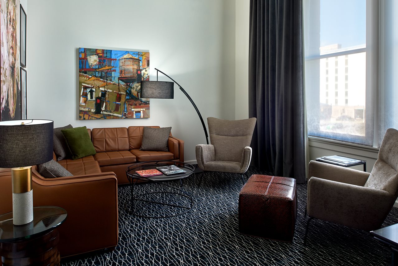 a living room with a couch and a painting