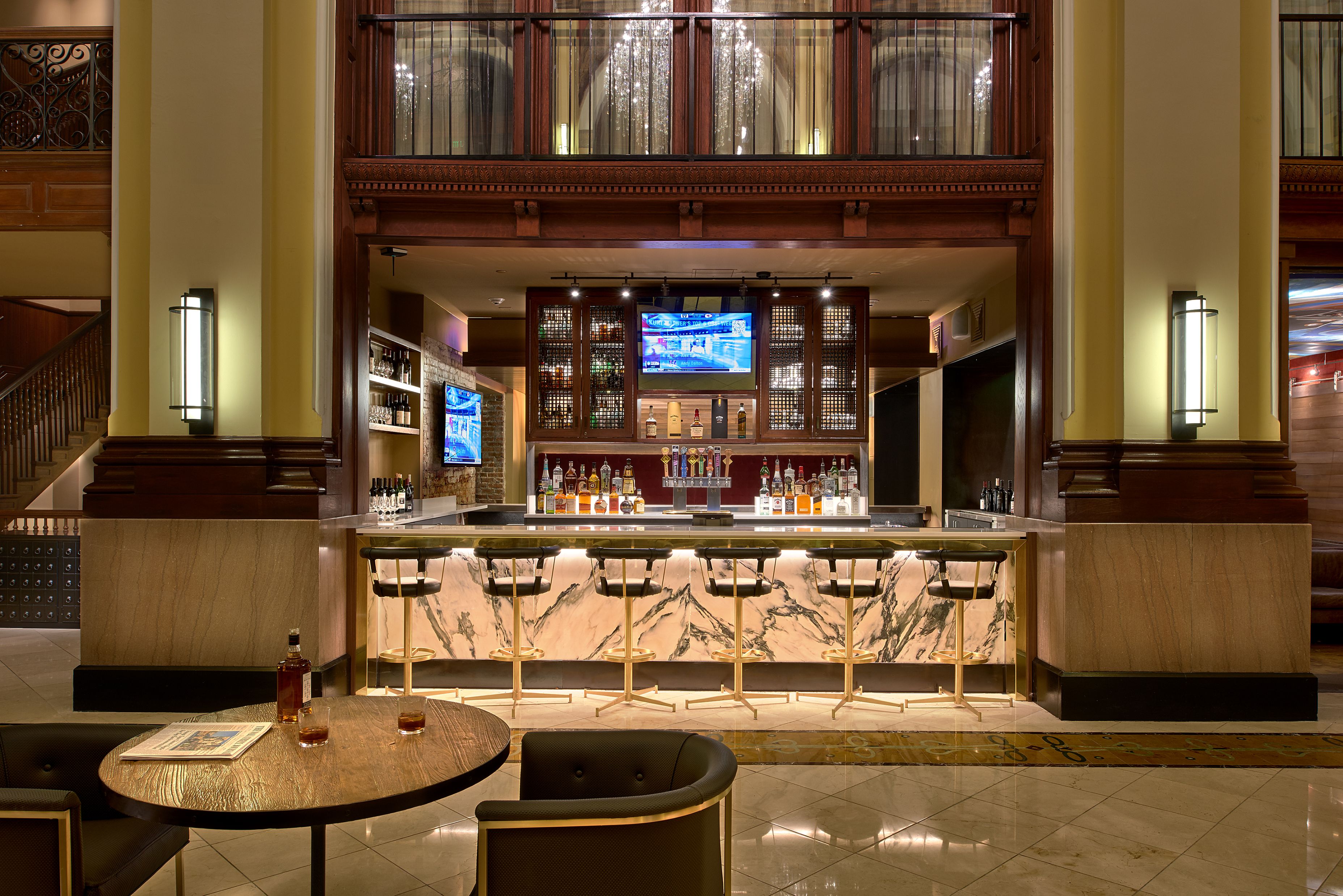 a bar with a counter and chairs
