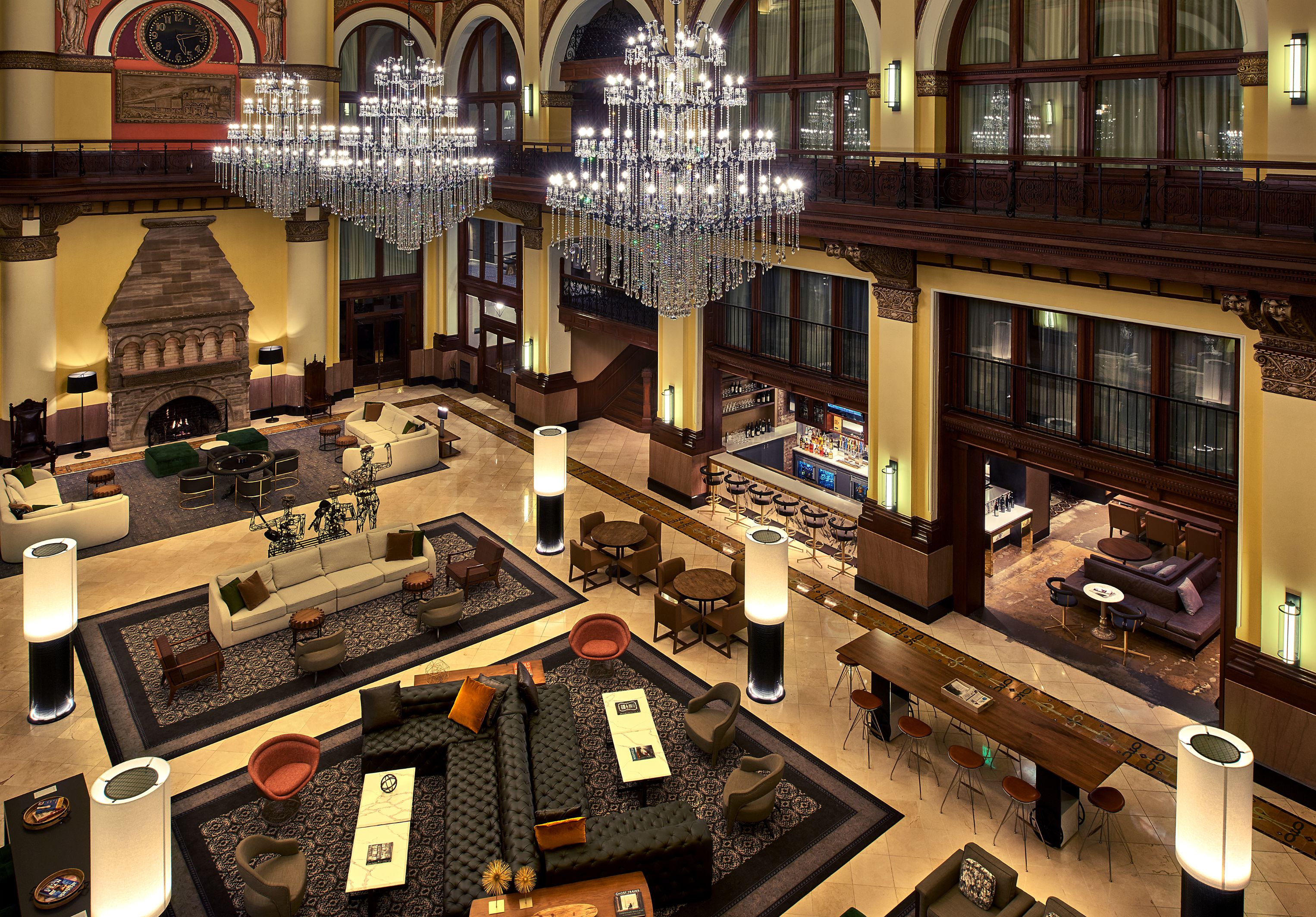 a large room with chandeliers and tables