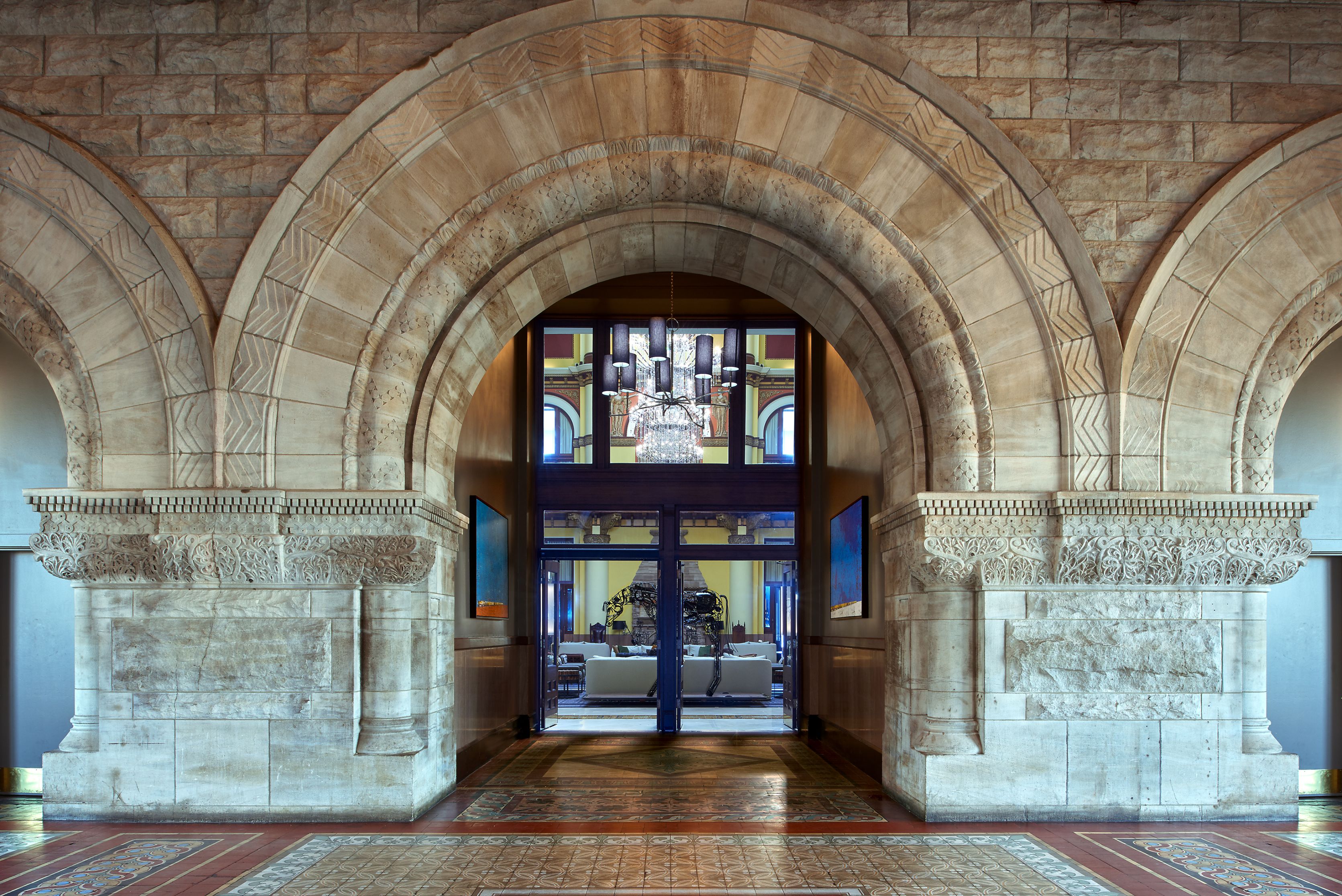 a stone archway with glass doors
