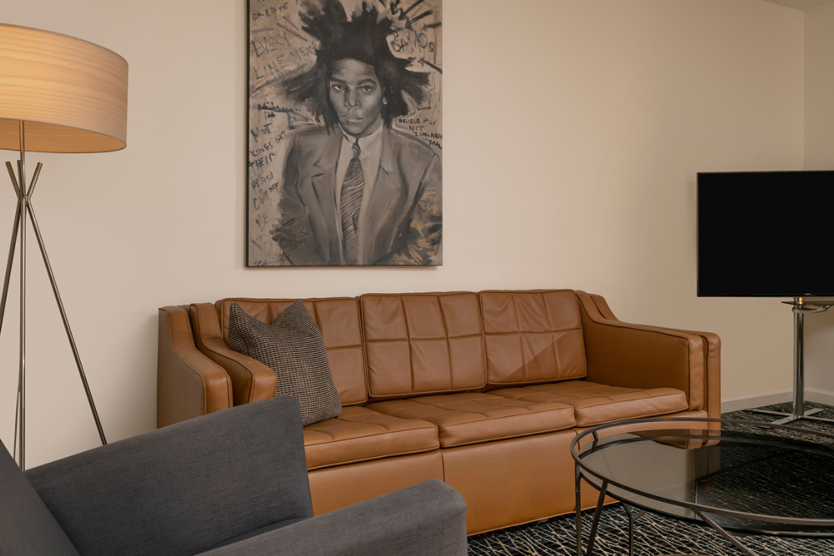 a couch and painting on the wall