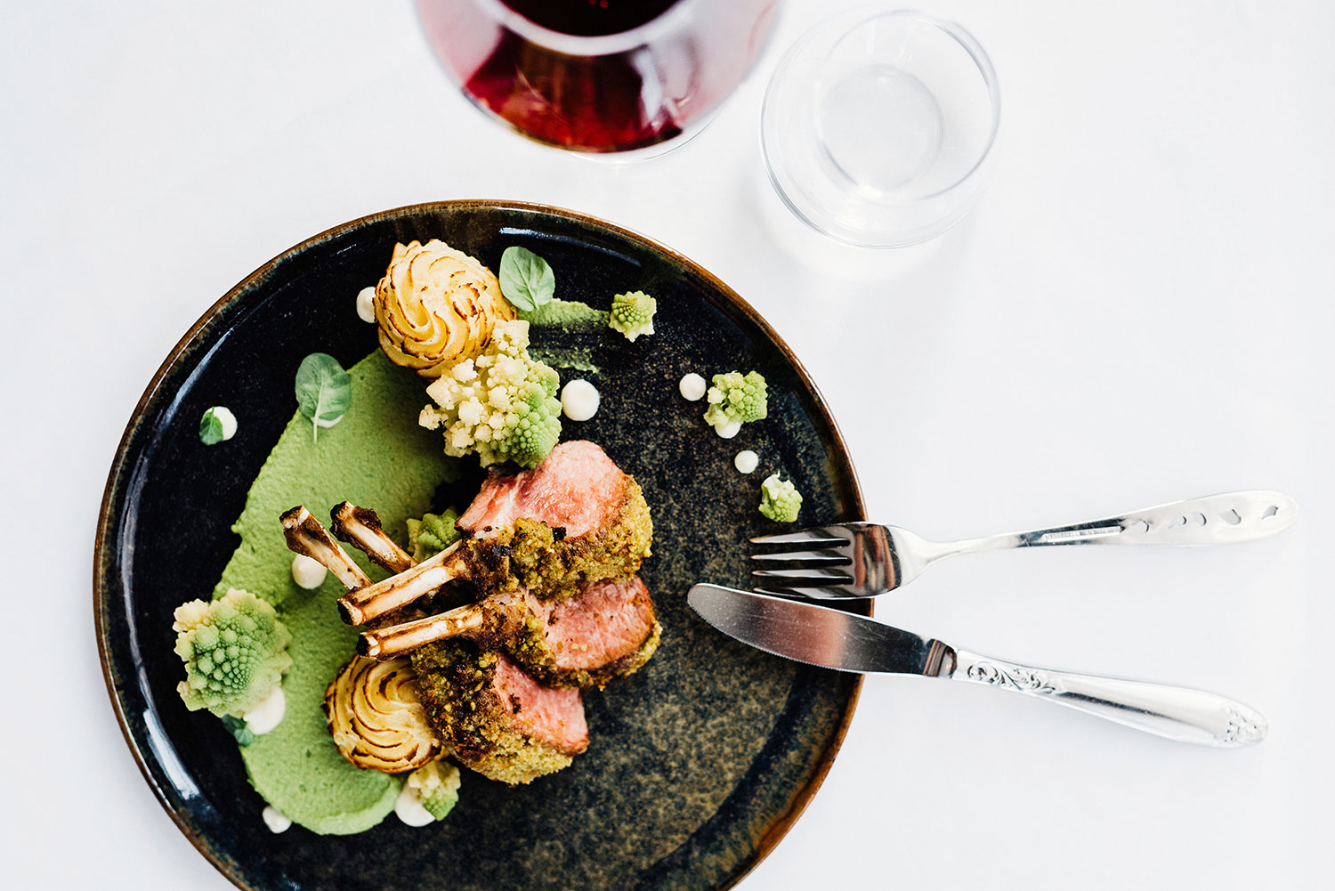 a plate of food with fork and knife