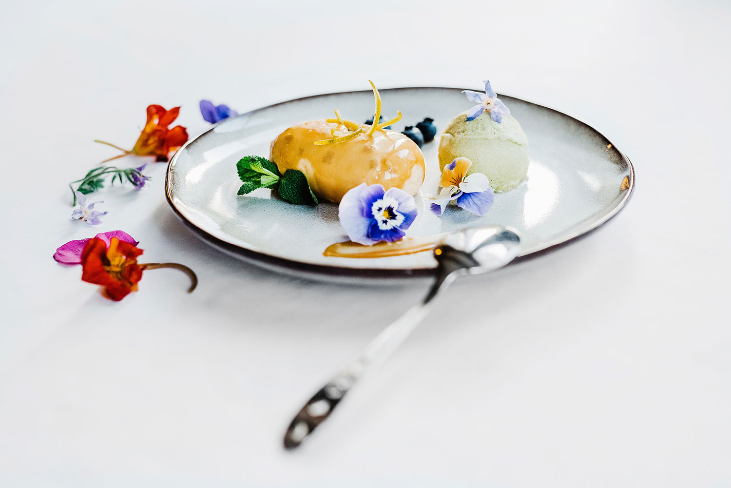a plate with food on it and a spoon