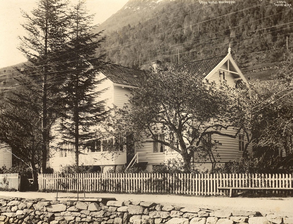 a house with a fence and trees