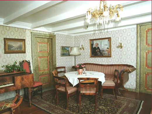 a dining room with a table and chairs