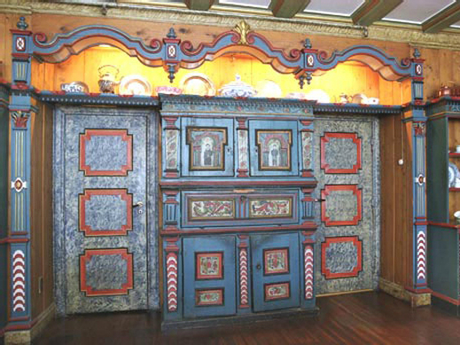 a blue and red painted cabinet
