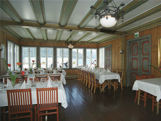 a room with tables and chairs