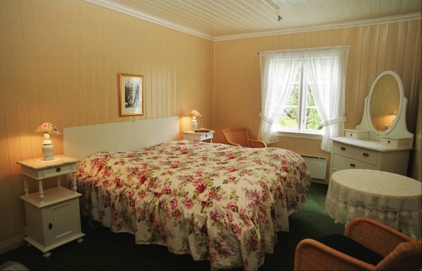 a bedroom with a bed and a table
