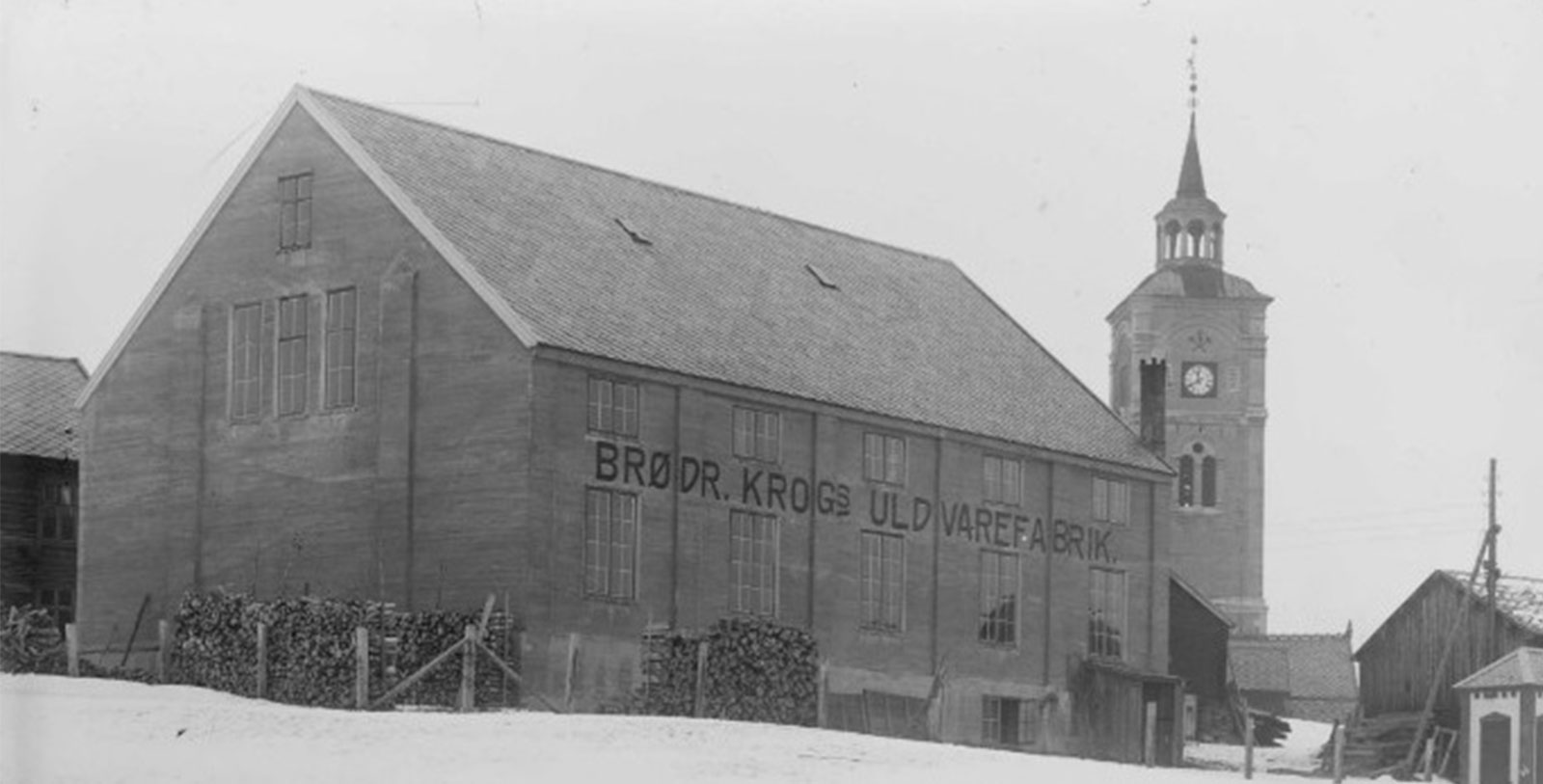 a building with a tower in the background