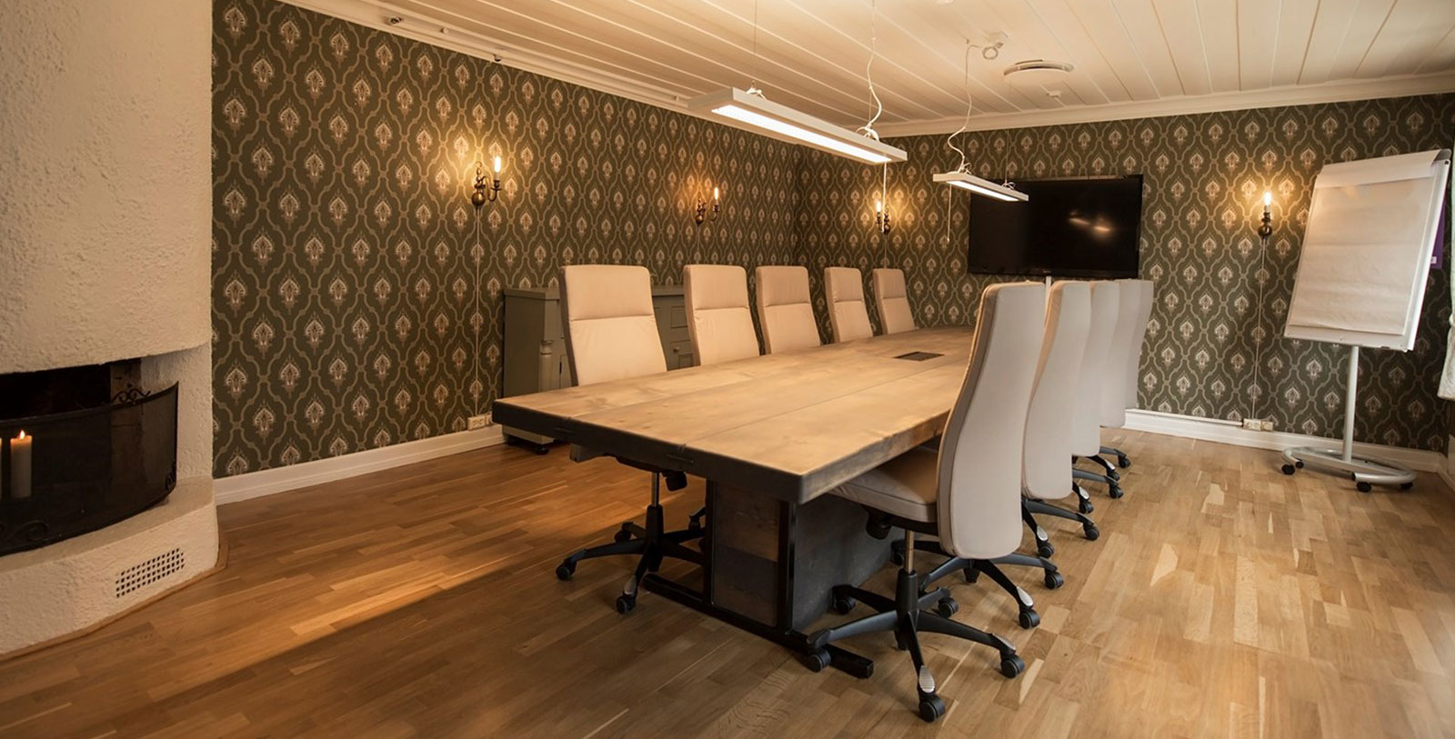 a conference room with a table and chairs