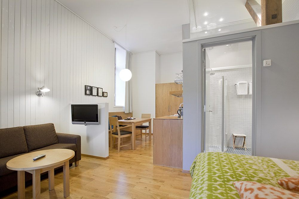 a room with a tv and a couch