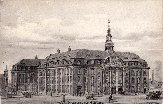 a large building with a steeple and people walking on the street