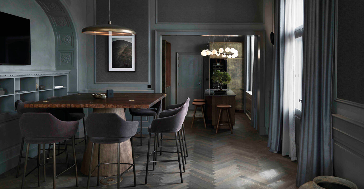 a dining room with a table and chairs