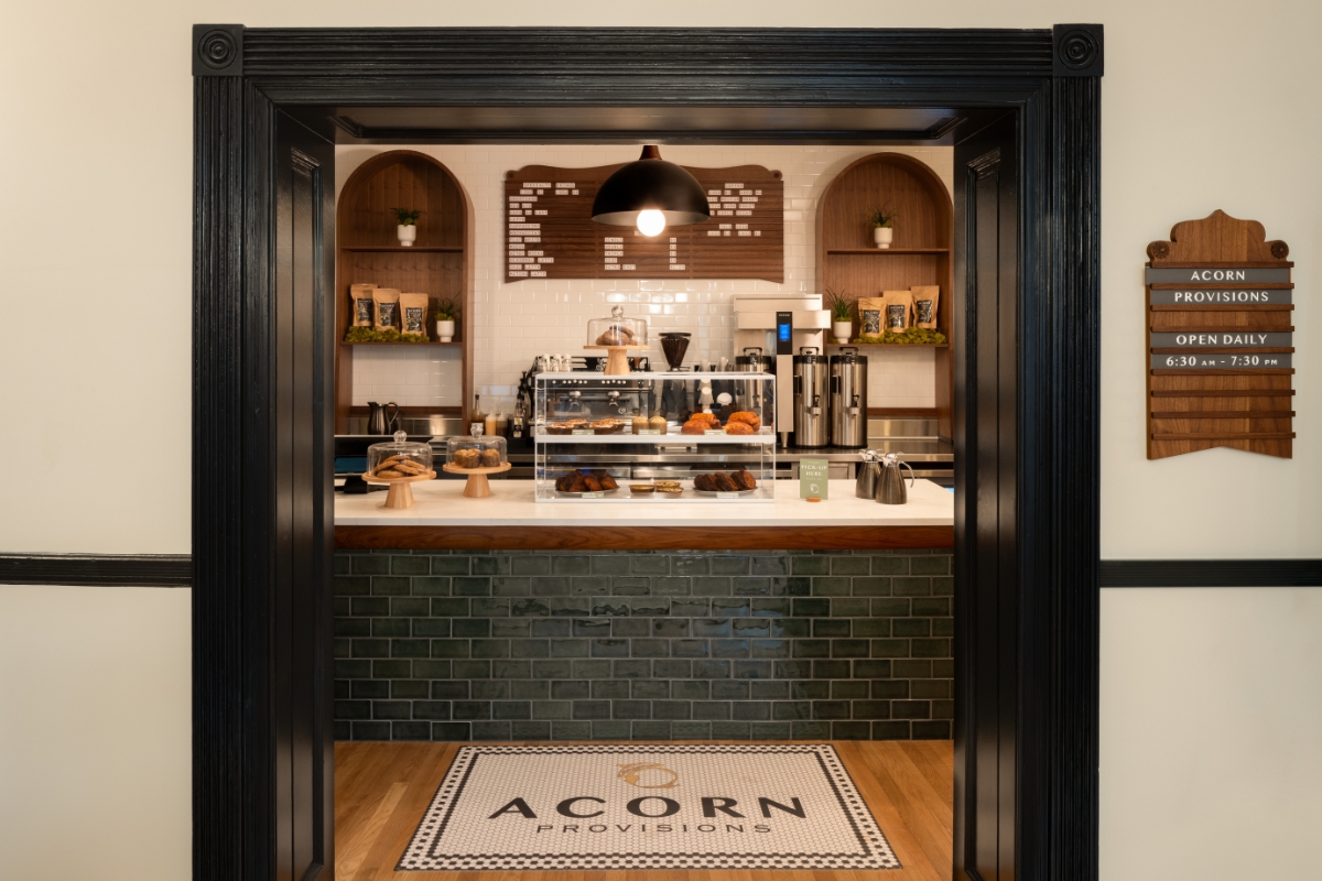 a coffee shop with a counter and a door open