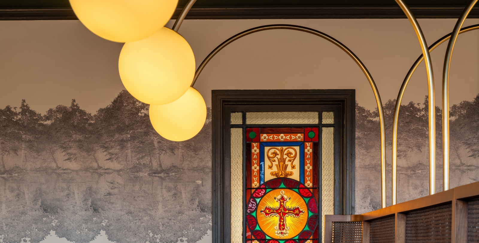 a stained glass door with a cross on it